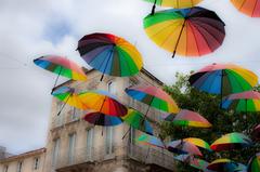 Colorful umbrellas hanging in Rochefort street