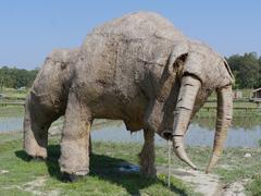 large animal figures made of rice straw near a reservoir in Huai Tueng Thao, Chiang Mai, Thailand