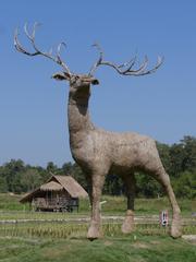 Large animal figures made from rice straw by the water in Huai Tueng Thao, Mae Rim.