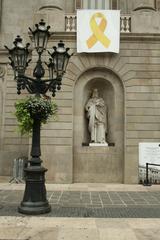 sculpture under classical portico with four columns