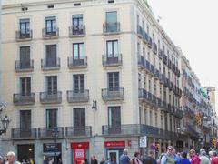 Streets of Barcelona with historic buildings and people walking