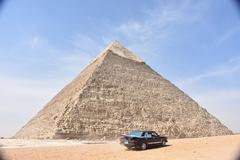 Car speeding past Pyramid of Khafre in Giza, Egypt