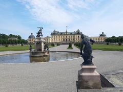 Drottningholm Palace from the park with fountain and statues