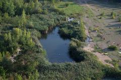 Deep pond in Růženin Quarry in Brno-Maloměřice viewed from the north