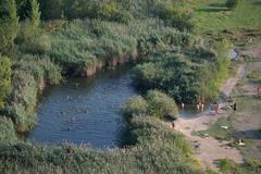 View of Hluboké Pond in Růženín Quarry from the north rock in Brno-Maloměřice