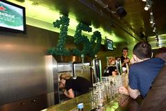 Heineken Experience facade in Amsterdam with tourists outside