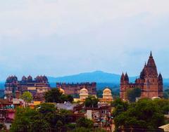 Historic monuments of Madhya Pradesh including Jahangir Mahal, Gwalior Fort, Ram Raja Temple, and Chaturbhuj Temple against the Vindhya Range.