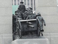 Canadian War Memorial in Ottawa with statues and an archway under a clear sky