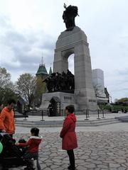 National War Memorial in Canada at Confederation Square in Ottawa with a bronze statue of soldiers and an archway