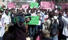 Rally in Rome to raise awareness about the Darfur genocide with refugees present