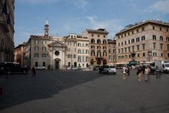 Rione VII Regola street view in Rome, Italy with old buildings and a cobblestone street