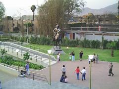 Statue of Francisco Pizarro in Lima with ancient walls in the background