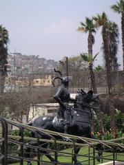 Pizarro statue in a new park with San Cristobal Hill in the background