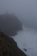 Point Bonita lighthouse in fog at sunset