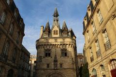 A vibrant street scene in Bordeaux with historic buildings and outdoor cafes