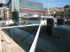 Darsena of Genoa's old port with submarine Nazario Sauro S 518 and Galata Maritime Museum in the background