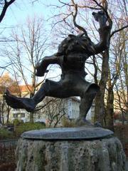 Bronze statue of Pumuckl at Pumucklbrunnen in Luitpoldpark, Munich