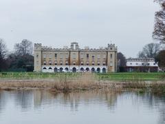 flooded area in Syon Park with a lion statue