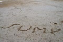 Jump written in the sand at Parc Güell