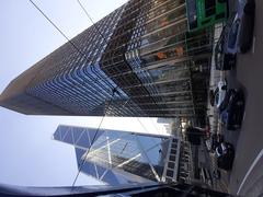 HK tram 95 on Des Voeux Road Central with Cheung Kong Center and Bank of China Tower in the background, November 2021