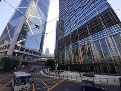 HK tram 95 on Des Voeux Road Central with Cheung Kong Center and Bank of China Tower in the background