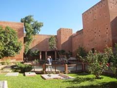 Marrakech cityscape with historical buildings and Atlas Mountains in the background