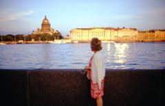 woman posing by the Neva River with St. Isaac's Cathedral in the background, Leningrad 1975