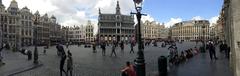 Grand-Place in Brussels on a sunny day with people walking