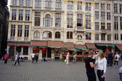 Grand Place in Brussels with historic buildings and people