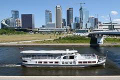 Boat on Neris River in Vilnius, Lithuania with New City Center in the background