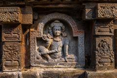 Carved stone panel of deities on temple in Nalanda