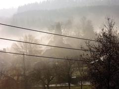 Dense autumn fog over the town of Bouillon in the early morning