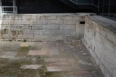 Freshwater pool in front of ancient city walls of Marseille