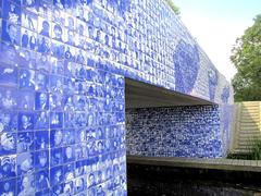 Elf-Städte-Tour Monument in Friesland near Giekerk covered with blue and white tiles depicting historic skaters