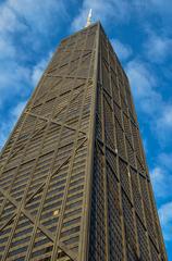 John Hancock building under a cloudy blue sky