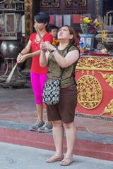 People with incense at Cheng Hoon Teng Temple