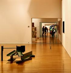 group of people observing art in a museum