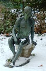 Statue of seated youth at Frankfurt Zoo