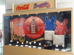 Coca-Cola bottles in front of Atlanta Braves sign