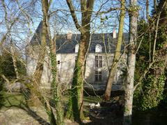 Renaissance castle of Dampierre-sur-Boutonne on its tree-covered islet surrounded by the waters of the Boutonne