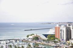 Street view of Comércio neighborhood in Salvador, Brazil with historical buildings and people