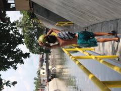 A boy walking along Naga river