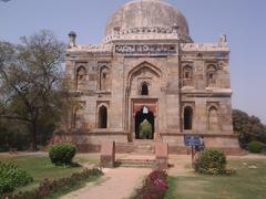 beautiful lush green garden with old era monuments