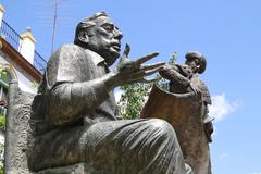 Statues of Manolo Caracol and Chicuelo in Alameda de Hercules, Seville, Spain