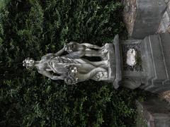 Statue with draining paint of a woman in Palazzo Mansi courtyard