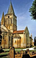 Saint-Pierre-de-la-Tour Church with tombstones and bell tower in Aulnay, France