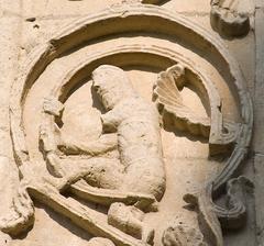 A character on the central window arch of the apse