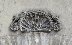 Top of a lintel with François I monogram at Cognac castle in Charente, France