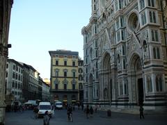 Piazza San Giovanni in Florence with historical buildings and tourists