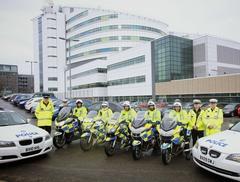 Police convoy escorting military ambulance in Birmingham